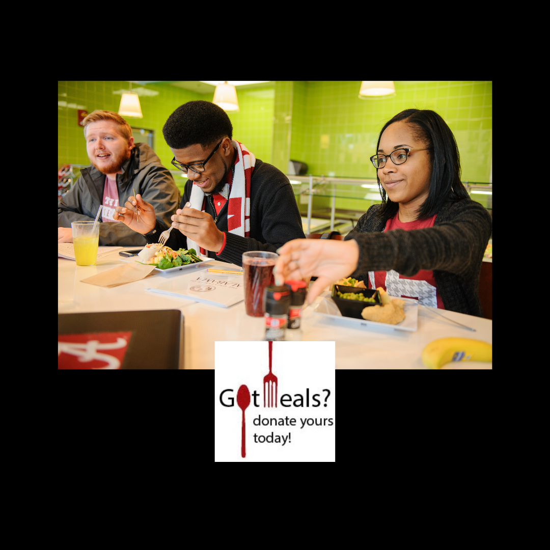 Picture of students eating in Fresh Food Company. In the center is a graphic of a fork and spoon with the words, Got Meals? Donate Yours Today!